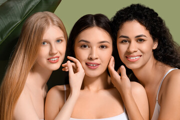 Beautiful young women on green background, closeup