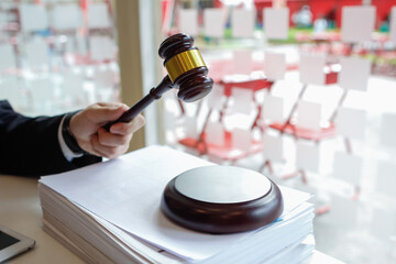 A judge gavel is prepared in the courtroom to be used to give a signal when the verdict is read after the trial is completed. Concept judge gavel is prepared to symbolize the decision in a court case.