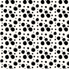 Creamy and black colors polka dot seamless pattern background