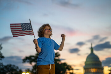 Child with American USA flag in Washington DC. Washington capital of USA. American people celebrate...