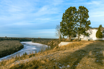 North Saskatchewan river valley landscape with footbridge and ice