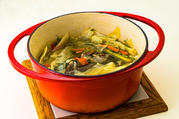 Pot of soup with vegetable and meat