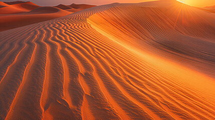 Sunrise over sand dunes in desert background with copy space