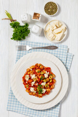 greek giant baked beans with feta, olives on plate