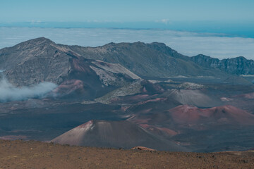 Fototapeta premium Cinder cone at Haleakala crater or the East Maui Volcano, is a massive, active shield volcano that forms more than 75% of the Hawaiian Island of Maui.