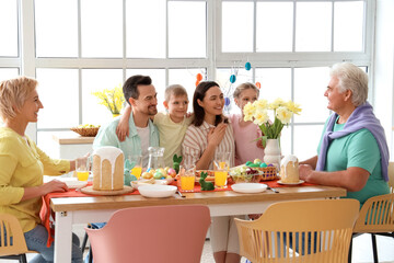 Big family having Easter dinner in kitchen - obrazy, fototapety, plakaty