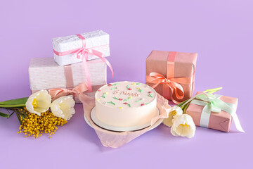 Sweet bento cake with gift boxes, beautiful tulips and mimosa flowers on lilac background. International Women's Day