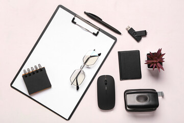 Glasses, pen, clipboard and computer mouse on white background