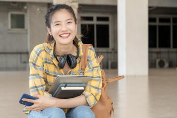 Portrait beautiful Asian woman student. Smile girl happy study. read book in college campus. young...