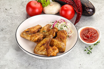 Grilled chicken wings with sauce