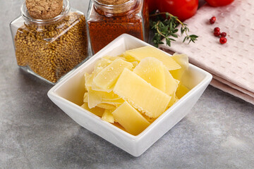 Sliced parmesan cheese in the bowl