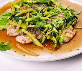 Fried fish fillet. cod with sauce and herbs