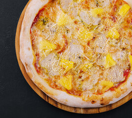 Tasty hawaiian pizza with chicken and pineapple