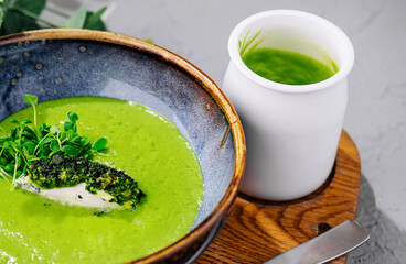 Broccoli, spinach cream soup in a bowl