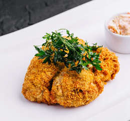 Chicken schnitzel with sauce on plate
