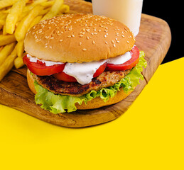 burger with french fries and milkshake close up
