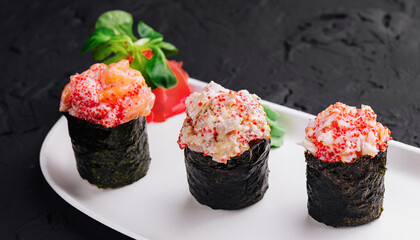 Different Gunkan Sushi on white plate