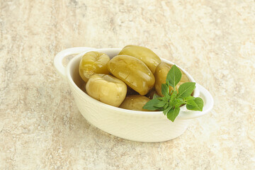 Pickled green tomato in the bowl