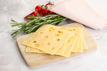Sliced maasdam cheese with holes