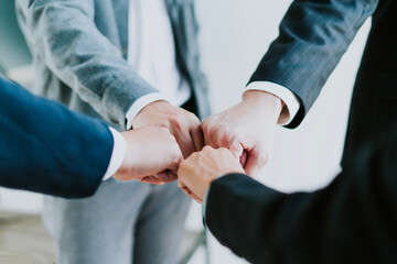 Cooperation, teamwork, and unity within the business organization show cooperation in working....