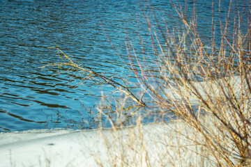
Melting ice on the river in early spring on a clear sunny day.