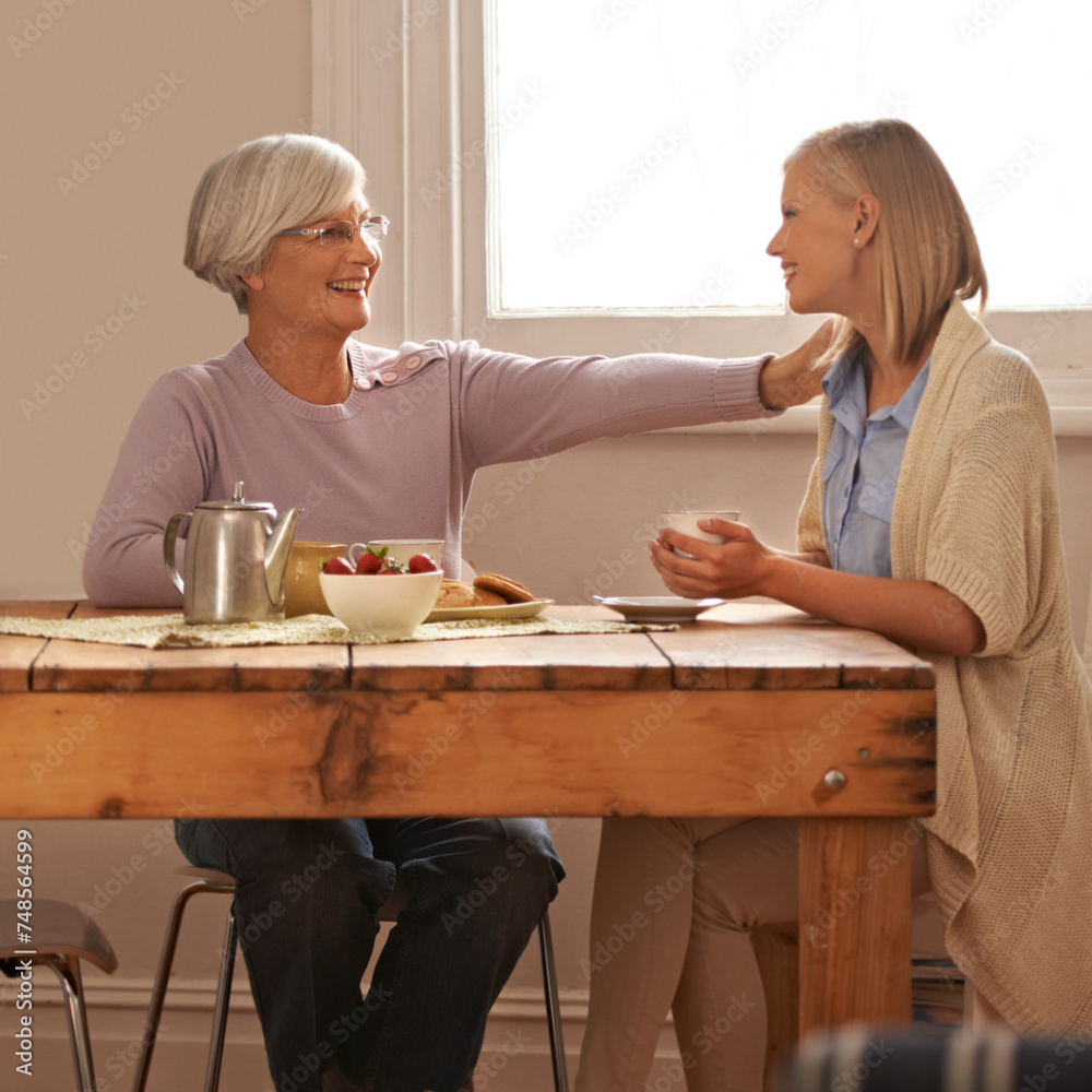 Wall mural House, senior and comfort to daughter, visit and elderly mom in dining table with food for breakfast, coffee and snacks with mother. Female person, smile and happiness with parent in family home