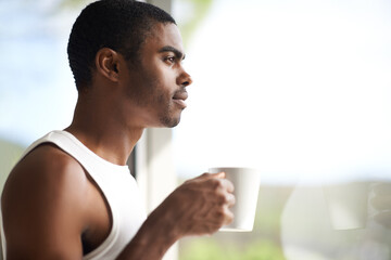 Black man, window and thinking with coffee for morning, start or ambition in dream or vision at...