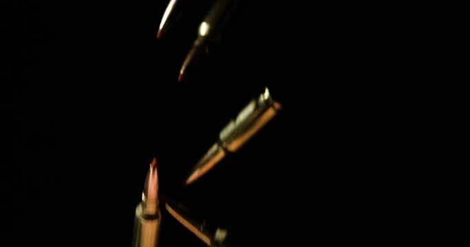 .300 AAC Blackout Plastic Tipped Falling Against Dark Background. - close up shot
