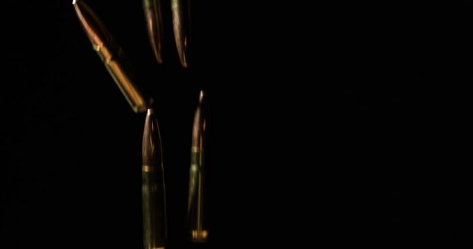 Falling 7.62&times;35mm Intermediate cartridge With 9mm Bullets In Slow Motion.