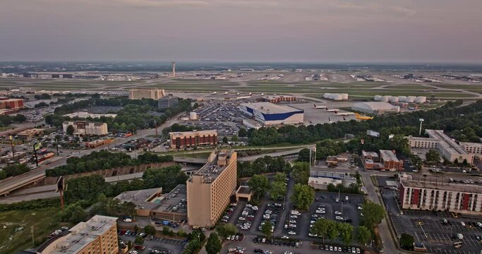 Atlanta Georgia Aerial v890 drone flyover Hapeville and College Park capturing activities on ATL Hartsfield Airport and featuring Delta North Hangar at sunset - Shot with Mavic 3 Pro Cine - June 2023