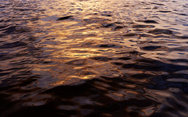 Seascape sun's rays reflect on sea surface at sunset - 748575781