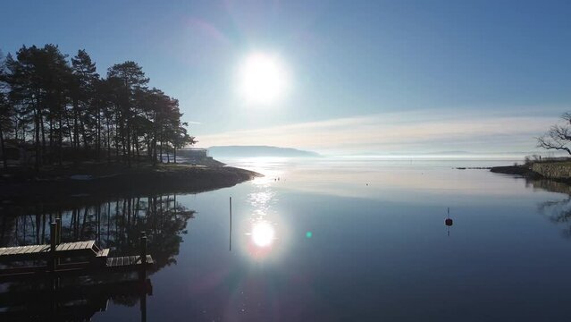 Huk beach during winter. Sunset and icy waters. 