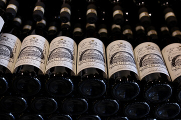 Fototapeta premium Neatly arranged bottles of Chianti Classico wine in a wine shop in Monteriggioni near Siena. Italy