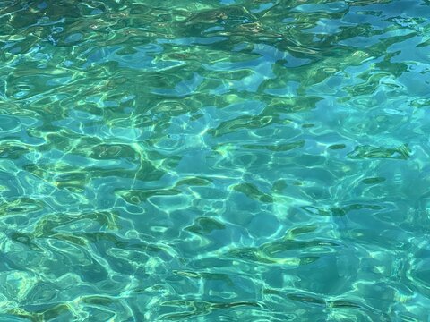 Sea surface crystal clear water.