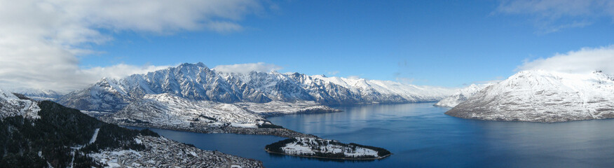 Aerial panoramic winter view of Queenstown, Lake Wakatipu and the Remarkables mountain range in the Southern Alps on New Zealand's South Island