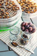 Plums dried in a dehydrator. Selective focus.