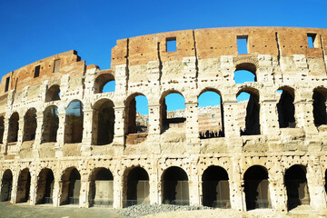 Fototapeta premium View of Colosseum against a blue sky in Rome, Italy
