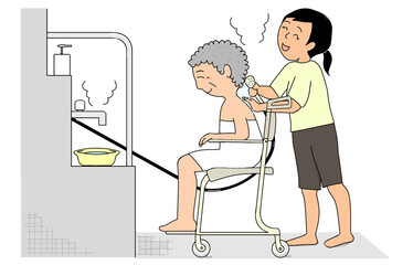 シャワーキャリーに座った高齢女性を介助する女性介護職員