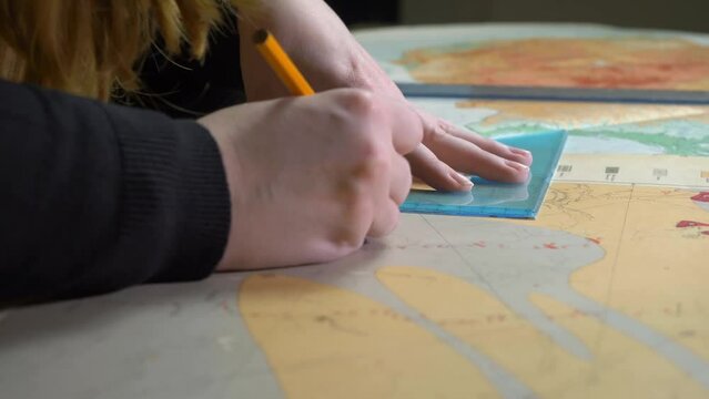 Academic Cartography: PhD Candidate Deciphers Maps in University Lab