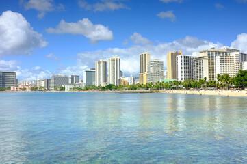 Obraz premium Beach, city and building development on coast for holiday destination in Miami for vacation, swimming or explore. Sea, skyscraper and urban downtown travel for summer getaway, architecture or water