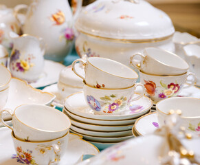 Antique French porcelain set with flowers and gold antiques