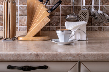 Cup of coffee on kitchen counter.