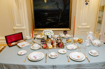 Antique French porcelain set with flowers and gold antiques