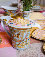 vintage 80 year Old porcelain Dinner set with flowers and butterflies 24 carat Gold