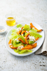 Healthy salad with roasted pumpkin and almond