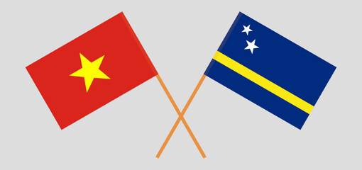 Crossed flags of Vietnam and Country of Curacao. Official colors. Correct proportion