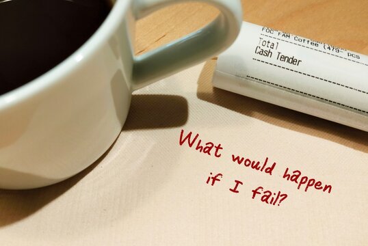 Paper napkin with handwriting WHAT WILL HAPPEN IF I FAIL? concept of SELF-DOUBT - lack of confidence regarding yourself and your abilities - imposter syndrome with work or relationships