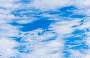 cloudy sky background for wallpaper and design, day skyscape with white beautiful clouds and blue...