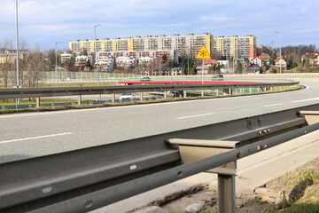 KRAKOW, POLAND - FEBRUARY 26, 2024: The Biezanow housing estate on the border of Krakow, where significant noise from the highway is a problem. - obrazy, fototapety, plakaty