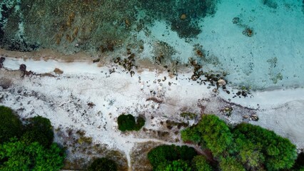 Drone view of a turquoise bay and a wild beach in Mallorca.